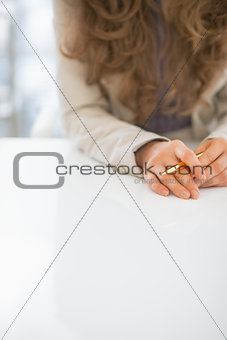Closeup on business woman sitting at desk