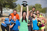 Smilng Lady Lifting Kettle Bell