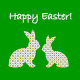 Silhouette of two Easter bunny rabbits decorated with chamomile 