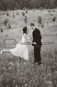 Young wedding couple outdoor. Groom and bride together.