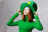 Red hair girl in Saint Patrick's Day leprechaun party hat