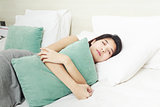 young beautiful Asian woman sleeping in bed