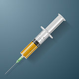 Syringe with yellow liquid