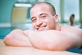 smiling man pool portrait