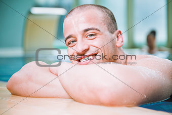 smiling man pool portrait