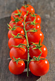 cherry tomatoes on vintage wooden table