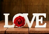 word love made of white wooden letters on wooden background
