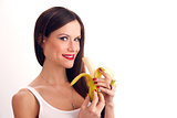Attractive Woman eats RAW food fruit banana white background