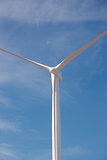 Wind Power Generator With Moon and Blue Sky Background
