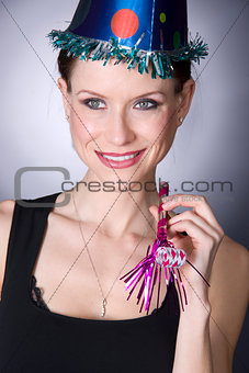 Pretty Woman has Fun in a New Years Eve Celebration Party Hat an