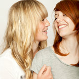 blond and red haired girls are laughing
