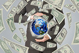 Businessman in a suit holding a earth