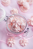 Pink meringues in a glass jar