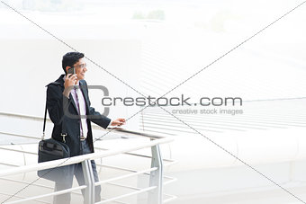 Candid Indian businessman talking on phone