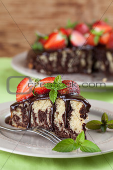 Marble cake with chocolate glaze and strawberries
