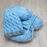 knitted cap and blue yarn