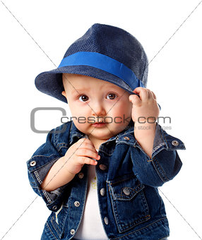 Cute baby boy holding hat