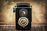 Old fashioned antique camera in vintage style