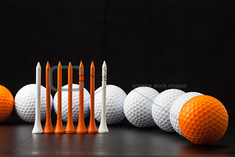 Golf balls on the black background