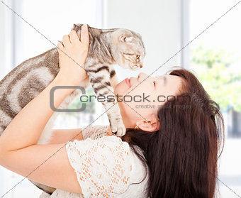 pretty woman hug and kiss her cat