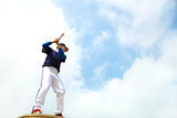  baseball player make a pose for hitting ball with blue sky