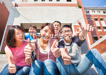  happy students thumbs up  together