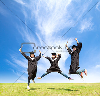 College students celebrate graduation and happy jump