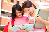 two students discuss homework  happily