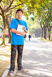 young student standing at campus 