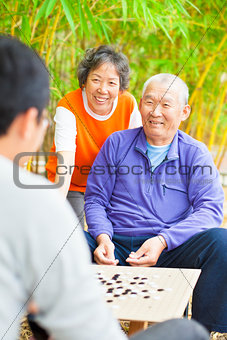 male seniors win a chinese board game ."weiqi"