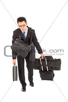 exhausted businessman taking all bags and suitcases 