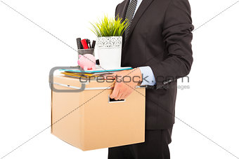fired businessman carrying his belongings