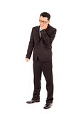 young businessman standing and in agony with a toothache