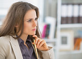 Portrait of concerned business woman sitting in office