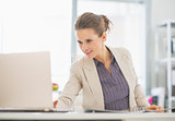 Business woman working with laptop in office