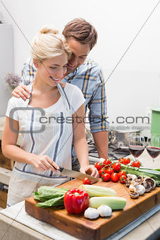 Couple preparing food together in the kitchen