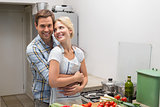 Young couple preparing food together in the kitchen
