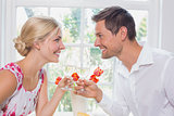 Happy young couple toasting wine glasses