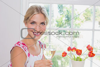 Portrait of a happy young woman with wine glass