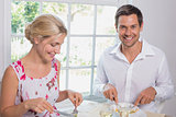 Portrait of a happy couple having food