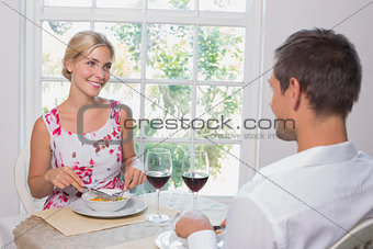 Happy couple having food