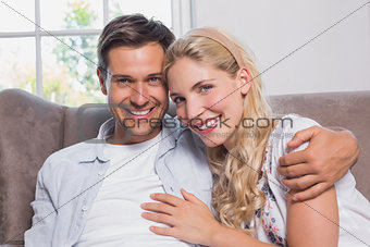 Portrait of relaxed cheerful loving couple at home