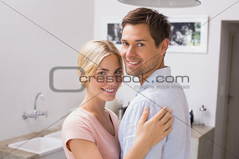 Smiling young couple embracing