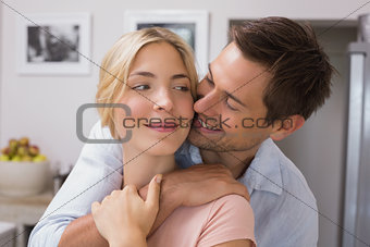 Close-up of a happy loving couple in kitchen