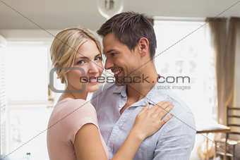 Happy loving young couple at home