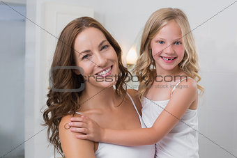 Portrait of a mother carrying daughter