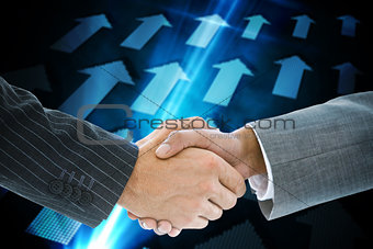 Composite image of business handshake against blue
