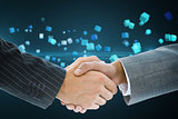 Composite image of business handshake against cubes