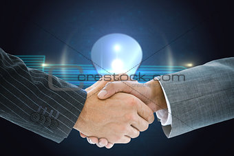 Composite image of business handshake against shiny light bulb