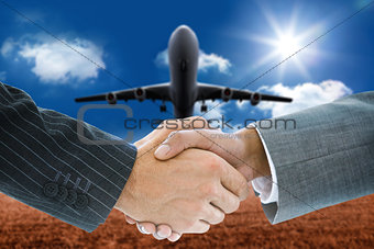 Composite image of business handshake against 3D plane